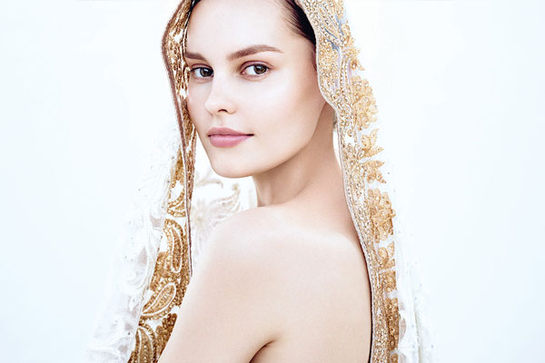 woman wearing golden shawl